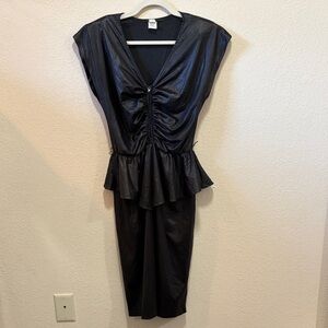 Vintage black ruched cocktail dress with peplum waist detail.